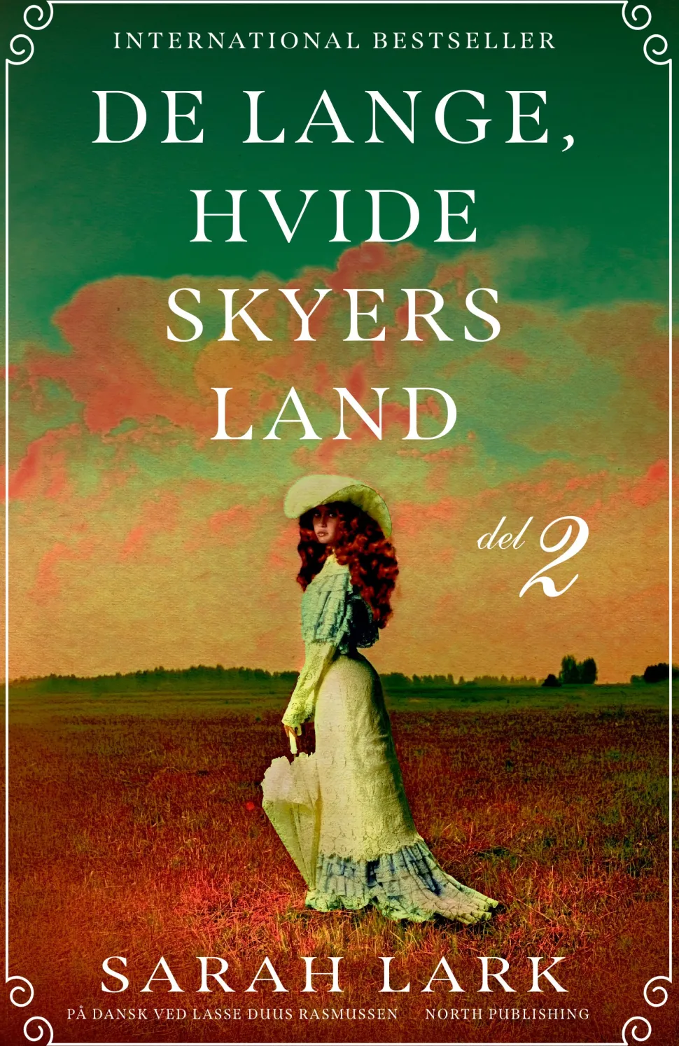 De lange, hvide skyers land - del 2 (Bog, Paperback, Dansk) af Sarah Lark